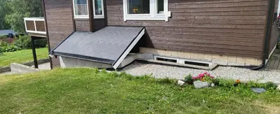 a house with a roof on the side of it at Free EV Charging with Snacks and View in Blesom