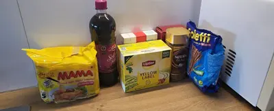 a bottle of beer and a bag of food on a counter at Free EV Charging with Snacks and View in Blesom