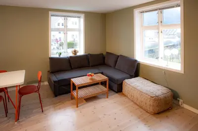 a living room with a couch and a table at Quiet place near city centre and the mountains in Bergen