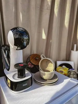a table with a blender and a bowl of food at A little corner of paradise in Molde