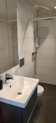 a bathroom with a sink and a toilet at Cottage in Hellesøy, Øygarden in Hellesøy