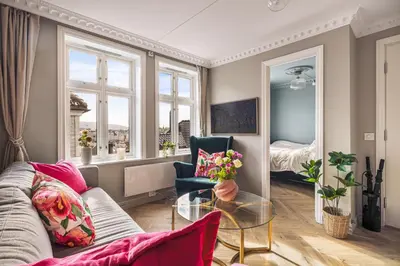 a living room with a couch and a glass table at Bispengsgaten 16 in Bergen