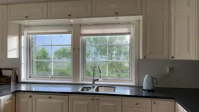 a kitchen with a sink and a window at Helt hus leies ut under fiskeri messe 2025 in Trondheim