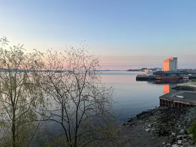 a view of a body of water with a dock at Exclusive flat with amazing view over the fjord in Trondheim