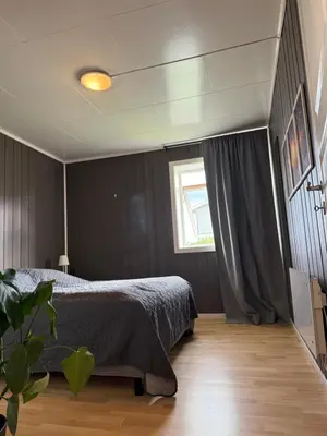 a bedroom with a bed and a window at Mai Tran in Gjøvik