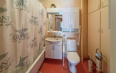 a small bathroom with a toilet and a sink at Stunning Home In Engerdal With Wifi in Nymoen
