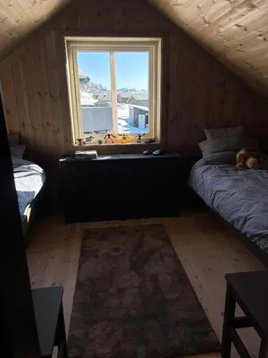 a small room with a bed and a window at Ski inn ski out, downhill and crosscountry Holtardalen in Torvetjørn