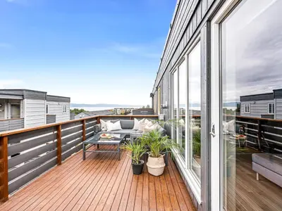 a balcony with a view of the ocean at Nice apartment with sea view in Trondheim