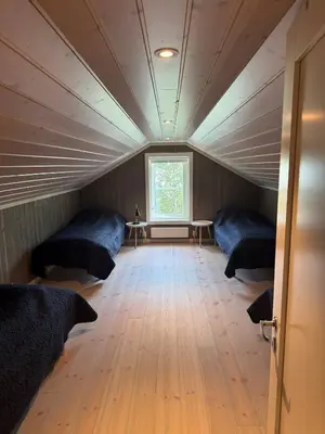 a room with two beds and a window at New cottage near the city center and ski slope in Hemsedal