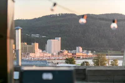 a group of kites flying in the sky over a city at Two bedroom penthouse with large living room and rooftop in the city centre of Trondheim in Trondheim