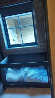 a shelf in a room with a window at 2 Cabins surrounded by beautiful nature in Stryn