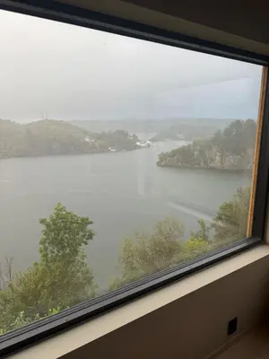 a view of a lake from a window at Modern detached house with a view in Arefjord