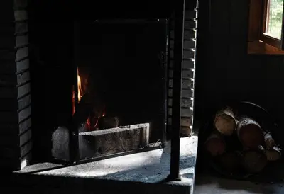 a brick oven with a fire inside of it at Waterfall Retreat in Sel