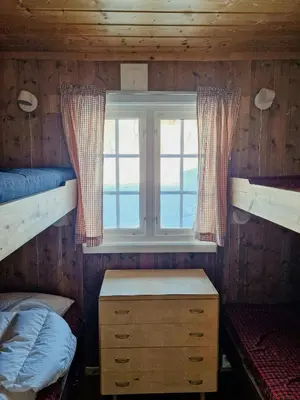 a bedroom with two bunk beds and a window at Mountain Cabin With Views Over Storevann in Hemsedal