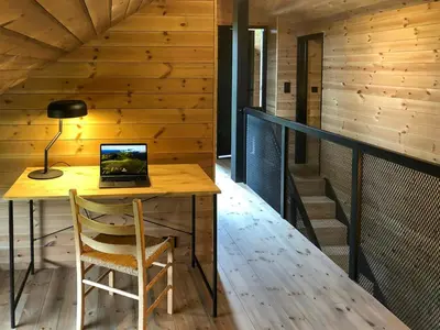 a laptop computer sitting on a desk in a room at Modern Cabin With Views Of Trysil Mountain in Trysil