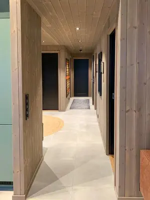 an empty hallway with wooden walls and a hallway with doors at Modern Cabin Close To The Ski Slopes In Haglebu in Eggedal