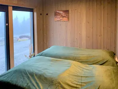 a bed in a room with a window at Modern Cabin Close To The Ski Slopes In Haglebu in Eggedal