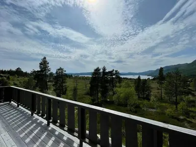 a balcony with a view of a lake and mountains at Family Cabin In Rauland in Rauland