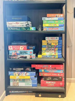 a book shelf filled with lots of books at Cabin With Views Over Hafjell And Gausdal in Svingvoll
