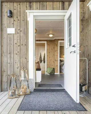 an open door to a room with wooden walls at Mountain Apartment By Trysil's Best Bike Trails in Trysil