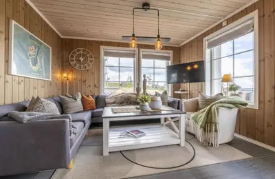 a living room with a couch and a table at Mountain Apartment By Trysil's Best Bike Trails in Trysil