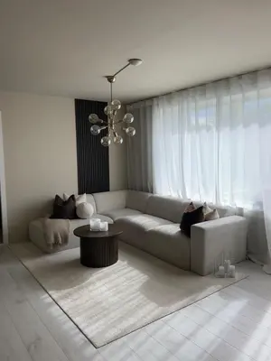a living room with a couch and a table at Elegant city apartment in Bergen- Private outdoor patio and free parking in Bergen