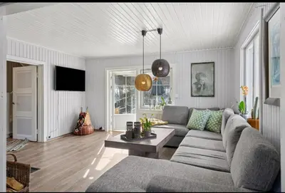 a living room with a couch and a table at Idyllic house in Hurdal 2 bedroom in Hurdal