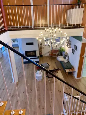 an overhead view of a living room with a chandelier at Large Architect Designed Home in City Centre in Hamar