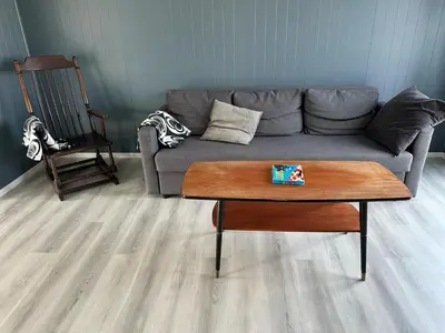 a living room with a couch and a coffee table at Sula in Frøya