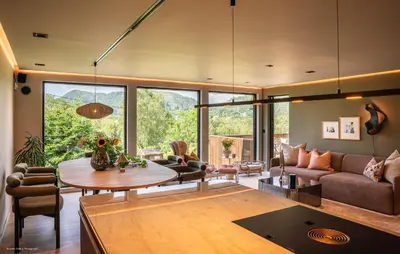 a living room with a couch and a table at Luxurious Home In Ytre Arna With Wifi in Ytre Arna