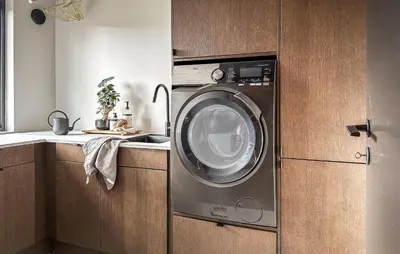 a kitchen with a washing machine in a kitchen at Luxurious Home In Ytre Arna With Wifi in Ytre Arna
