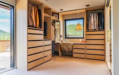 a walk in closet with a desk and a window at Luxurious Home In Ytre Arna With Wifi in Ytre Arna