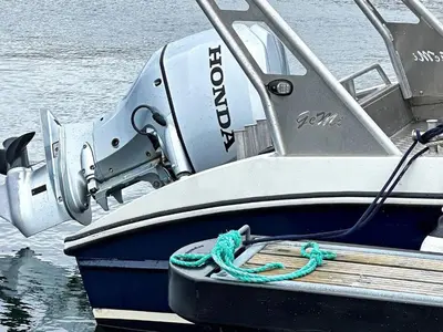 a boat with a rope attached to a dock at 5 person holiday home in Oksvoll in Oksvoll