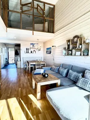 a living room with a couch and a table at Pellestova - Hafjell in Øyer