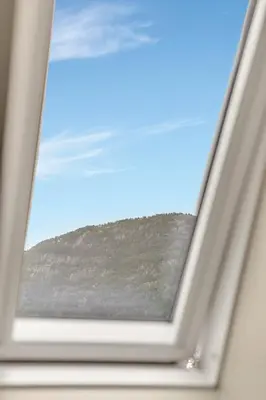 a window with a view of a mountain at 307SB10 - Three Bedroom Stay in Bergen