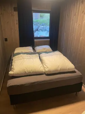 a bed in a room with a window at Flott hytte i Sogndal skisenter-Hodlekve in Sogndal