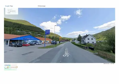an empty street in a small town with a mountain at Sentrumsvegen 28, GOL in Gol
