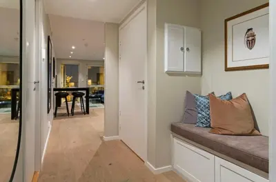 a hallway of a home with a couch and a dining room at J og F in Bergen