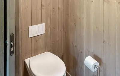a bathroom with a toilet and a roll of toilet paper at 3 Bedroom Awesome Apartment In Hemsedal in Hemsedal