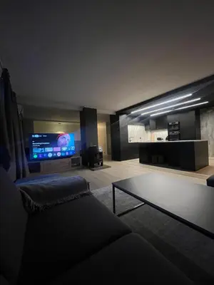 a living room with a couch and a tv at Stort hus i Steinkjer in Steinkjer