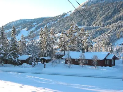 a house in the snow with a ski lift at Tveitehaug cabin, 3-4 bedroom cabin close to ski center in Ål