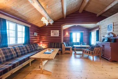 a living room with a couch and a table at Tveitehaug cabin, 3-4 bedroom cabin close to ski center in Ål