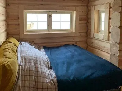 a room with a bed in a log cabin at Log Cabin With Panoramic Views Of Hallingskarvet in Holo
