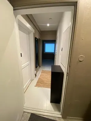 a hallway with a door leading into a room at Dronningens Gate 95, H0301 in Lii