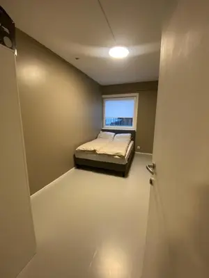 a small bedroom with a bed and a window at Dronningens Gate 95, H0301 in Lii