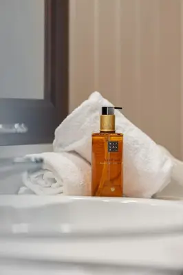 a bottle of soap sitting on top of a towel at Fagerasen 760B by Vacation Trysil in Trysil