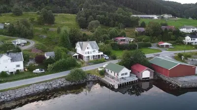 an aerial view of a town with houses and a river at Gemütliche Ferienwohnung am Fjord