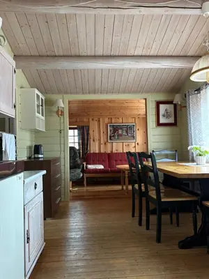 a kitchen and dining room with a table and chairs at Bjorliheimen Fjellhotell-Hytte 9 in Bjorli