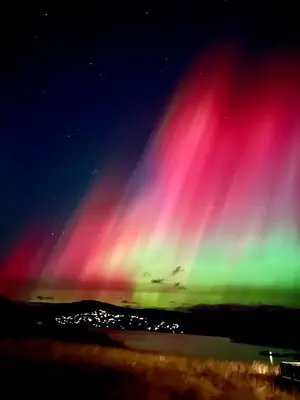 a display of the northern lights at night at Modern cabin sauna, BBQ & beautiful view Filefjell in Tyinkrysset