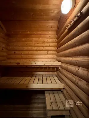 a wooden sauna with a bench in the middle at Beitostølen Cabin - Sauna, large terrace and BBQ in Beitostøl